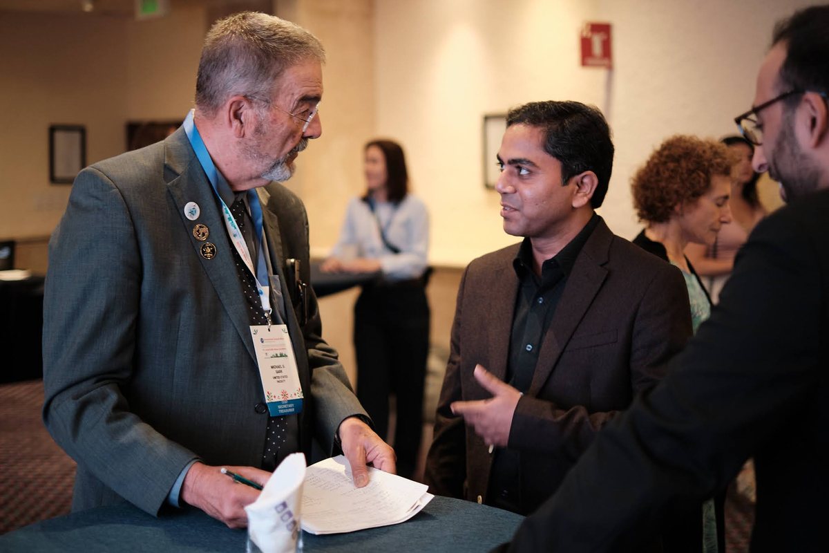 Participants in conversation at the reception